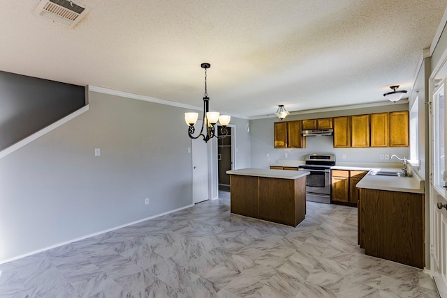 kitchen featuring a center island, an inviting chandelier, ornamental molding, stainless steel range, and decorative light fixtures