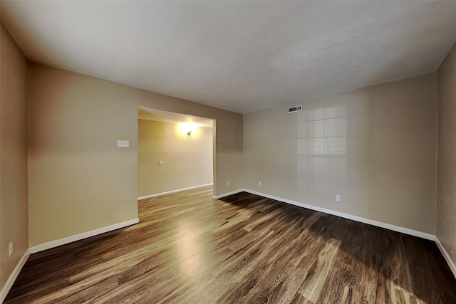 unfurnished room featuring hardwood / wood-style flooring