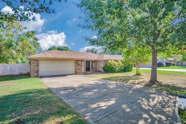 ranch-style house featuring a front lawn and a garage