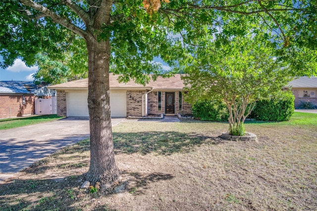 view of front of home featuring a garage and a front lawn