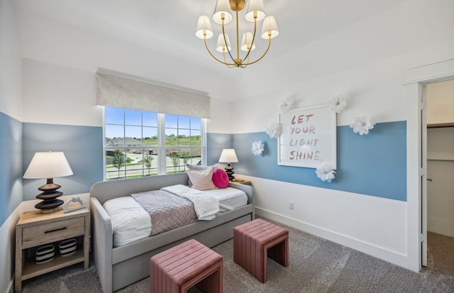 carpeted bedroom featuring a notable chandelier