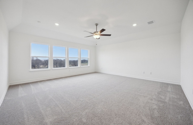 living room with ceiling fan, dark hardwood / wood-style floors, and a tiled fireplace