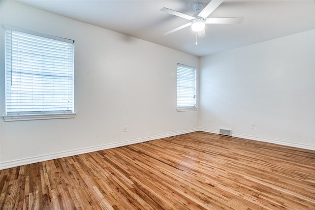 unfurnished room with ceiling fan and light hardwood / wood-style floors