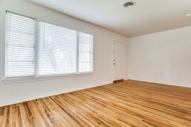 spare room with light wood-type flooring