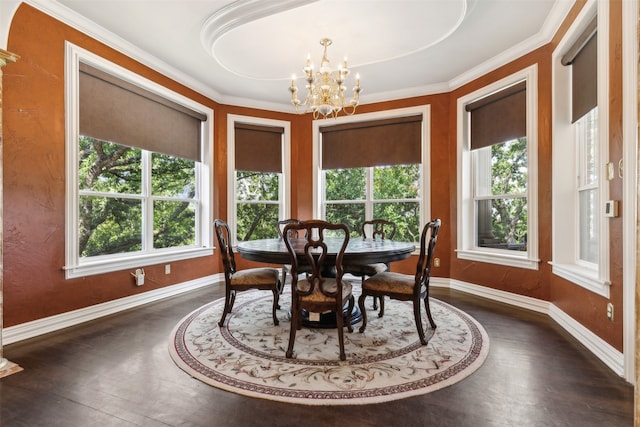 dining room with dark hardwood / wood-style flooring and a notable chandelier