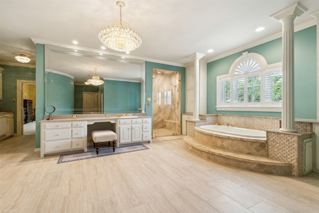 bathroom featuring separate shower and tub, a notable chandelier, decorative columns, vanity, and crown molding