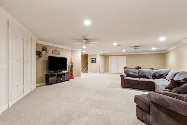 carpeted living room with ceiling fan and ornamental molding