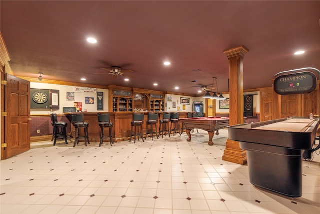 recreation room featuring crown molding, ornate columns, pool table, indoor bar, and ceiling fan