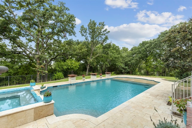 view of swimming pool featuring a patio area