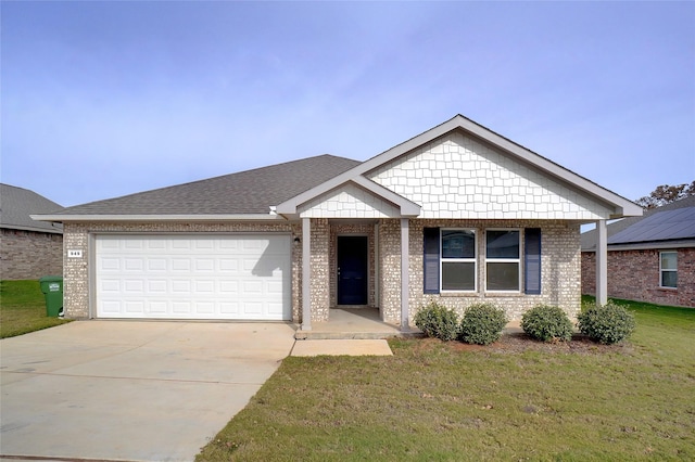 view of front of home with a garage and a front yard