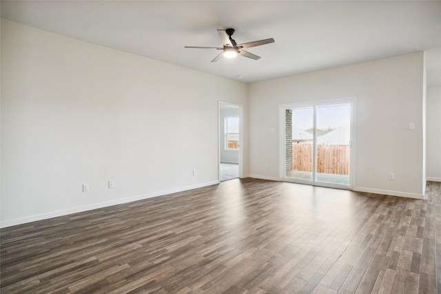 unfurnished room featuring ceiling fan and dark wood-type flooring