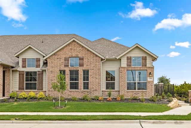 craftsman-style home featuring a front yard