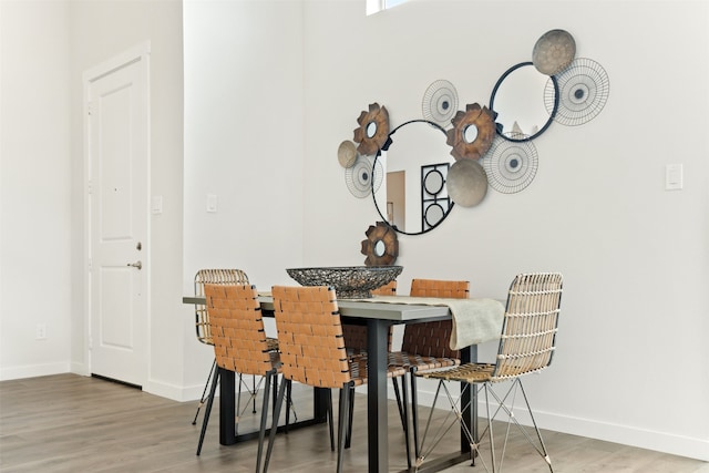 dining space featuring hardwood / wood-style floors