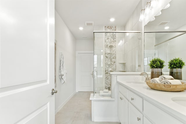 bathroom with vanity, tile patterned floors, and a shower with shower door