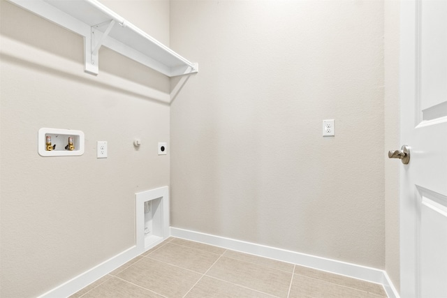 laundry area with light tile patterned floors, hookup for a gas dryer, laundry area, washer hookup, and electric dryer hookup