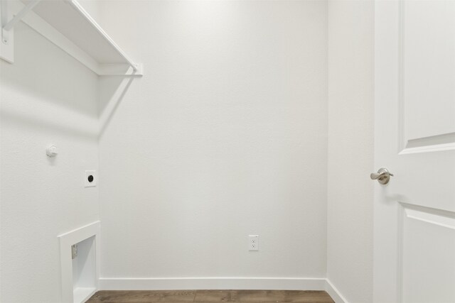 washroom with electric dryer hookup and wood-type flooring