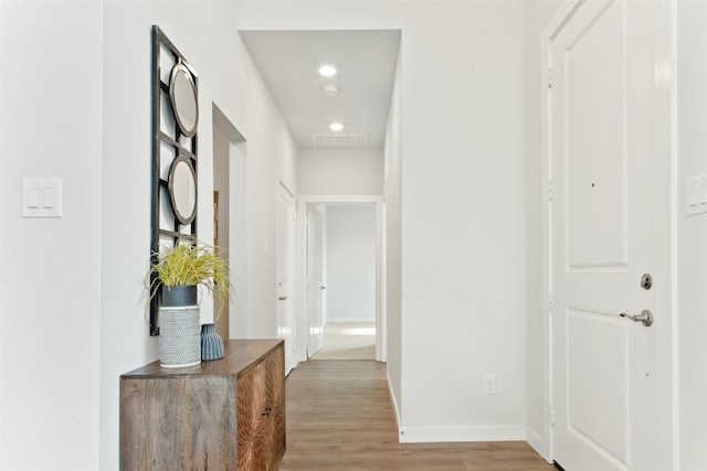 hall with light hardwood / wood-style flooring