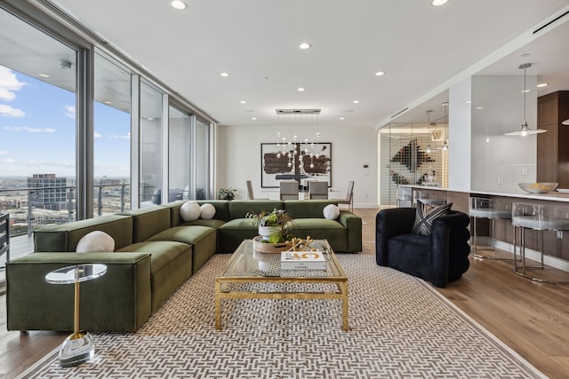 living room featuring ceiling fan and hardwood / wood-style flooring