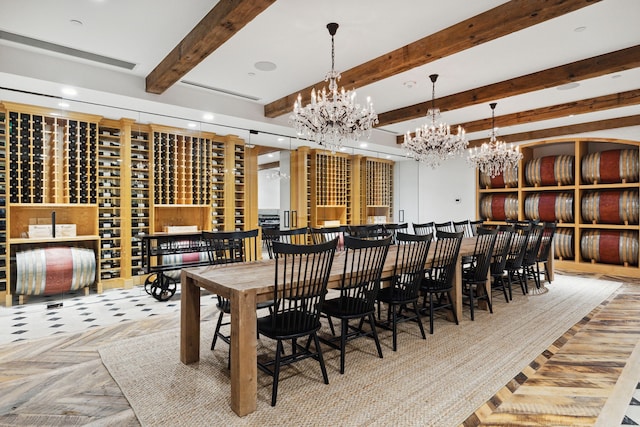 wine room with an inviting chandelier, beam ceiling, and parquet flooring