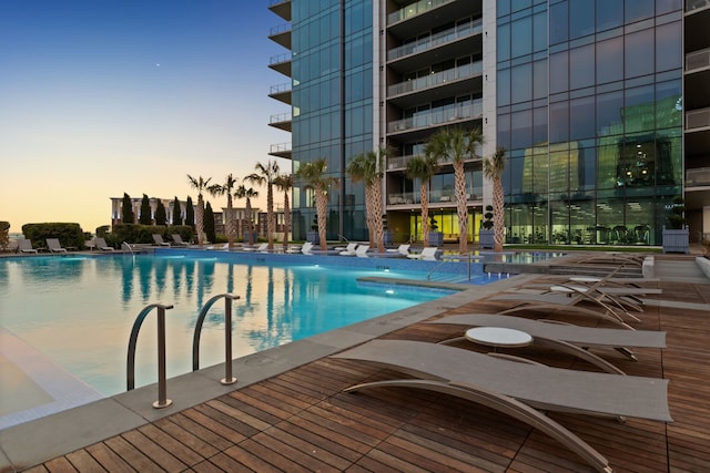 view of pool at dusk