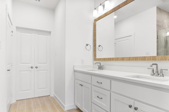 bathroom featuring wood-type flooring, vanity, and a shower with door