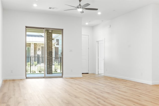 spare room featuring light hardwood / wood-style floors and ceiling fan