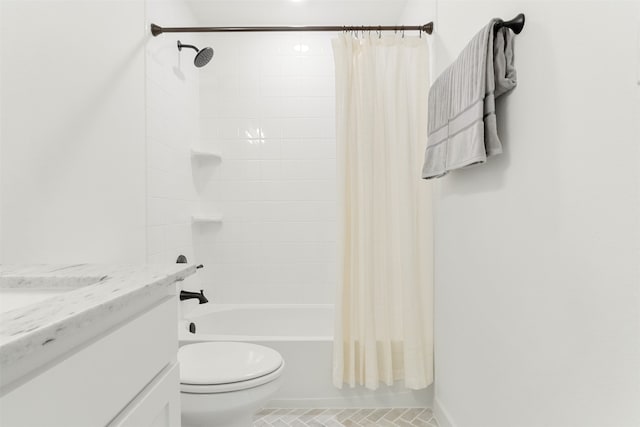 full bathroom featuring vanity, shower / bath combo with shower curtain, and toilet