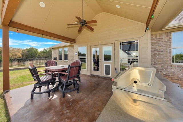 view of patio / terrace with area for grilling, ceiling fan, and french doors