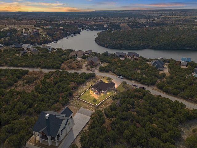 aerial view at dusk with a water view