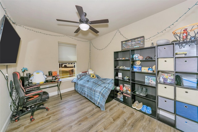 bedroom featuring ceiling fan and wood-type flooring