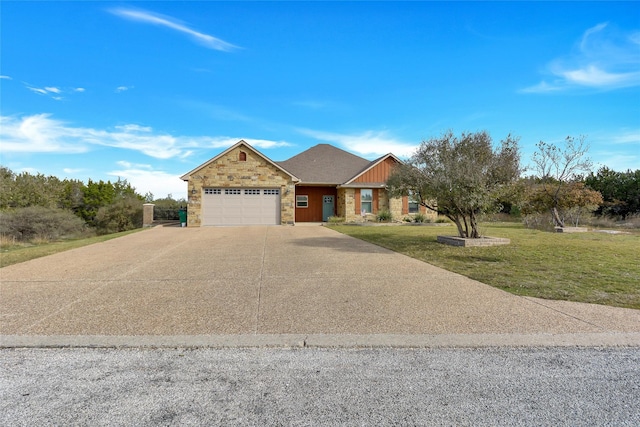 view of front facade with a front yard and a garage