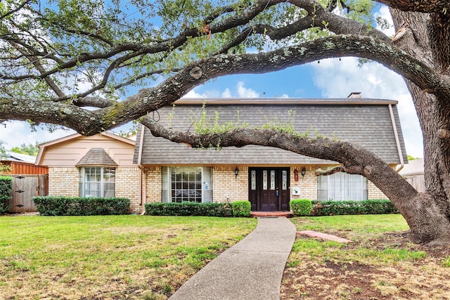 view of front of property featuring french doors and a front yard