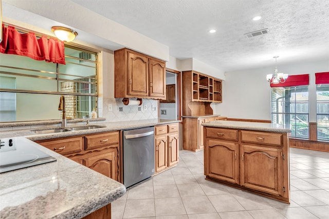 kitchen with light tile patterned flooring, sink, stainless steel dishwasher, a kitchen island, and pendant lighting