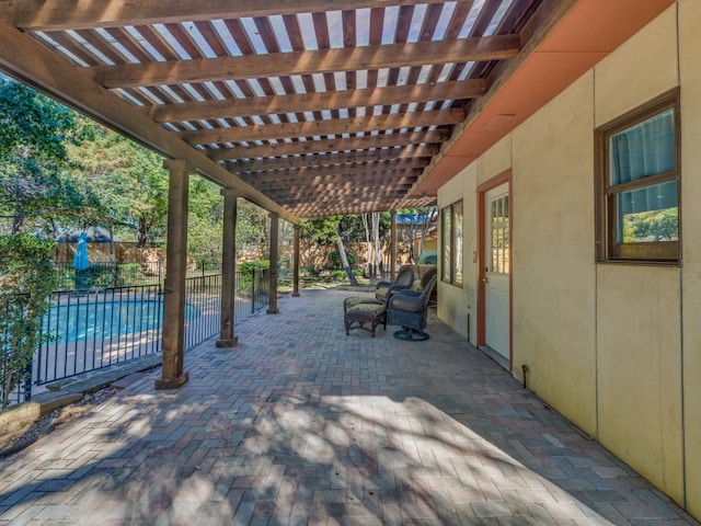 view of patio featuring a pergola and a fenced in pool