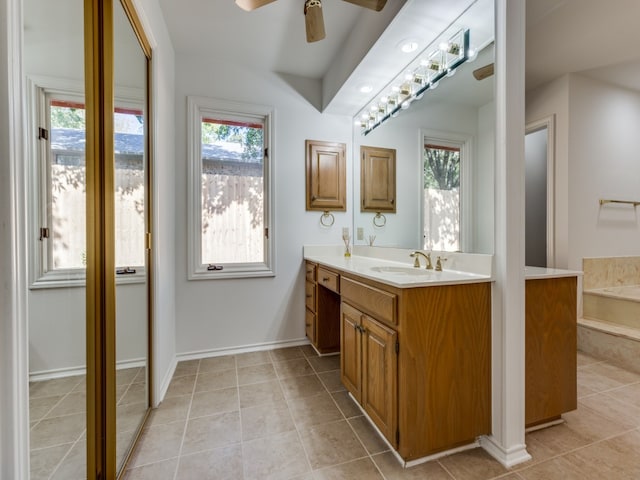 bathroom featuring tile patterned floors, ceiling fan, and vanity