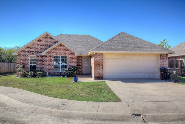 ranch-style home featuring a front lawn and a garage