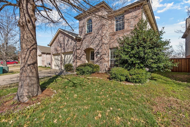 view of front of property with a garage and a front yard