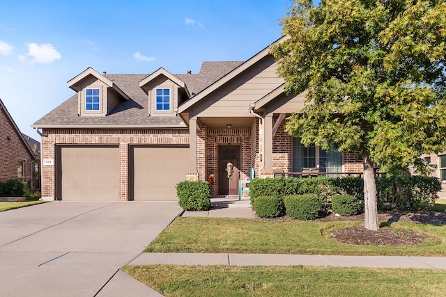 view of front of property featuring a garage, a front yard, and a porch