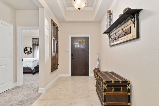 521 Butterfly Blvd, Prosper, TX 75078 - foyer entrance featuring a tray ceiling, light tile patterned floors, and baseboards