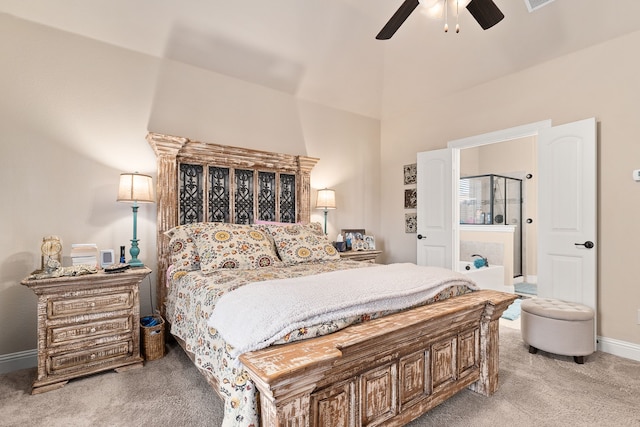 carpeted bedroom with ceiling fan and vaulted ceiling