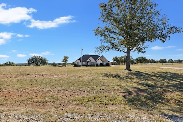 view of yard with a rural view