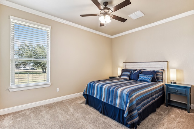 bedroom with carpet, ceiling fan, and crown molding