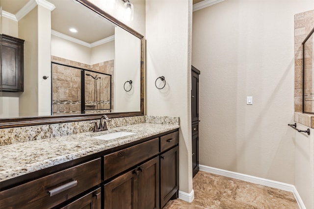 bathroom with vanity, an enclosed shower, and crown molding