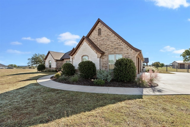 view of property exterior featuring a lawn