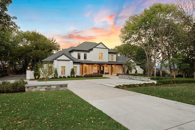 view of front of property with a yard