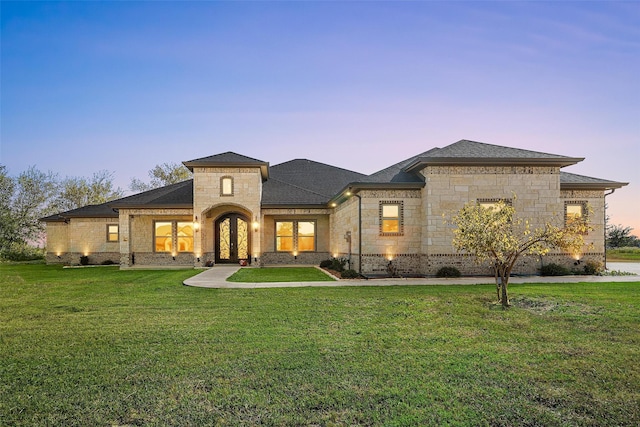 1055 Encino Ct, Wills Point, TX 75169 - french country inspired facade featuring stone siding, a yard, french doors, and a shingled roof