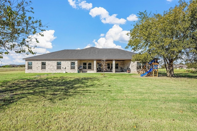 1055 Encino Ct, Wills Point, TX 75169 - rear view of property with a playground, a lawn, and a patio