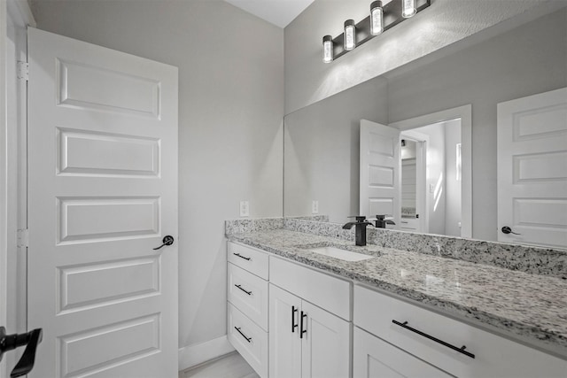 1055 Encino Ct, Wills Point, TX 75169 - bathroom featuring vanity and baseboards