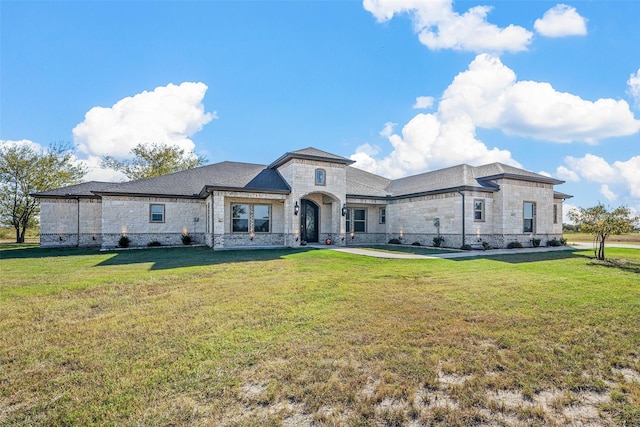 1055 Encino Ct, Wills Point, TX 75169 - french country inspired facade featuring stone siding and a front yard