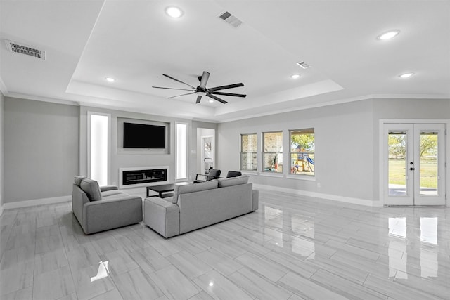 1055 Encino Ct, Wills Point, TX 75169 - living room featuring a raised ceiling, baseboards, a ceiling fan, recessed lighting, and ornamental molding